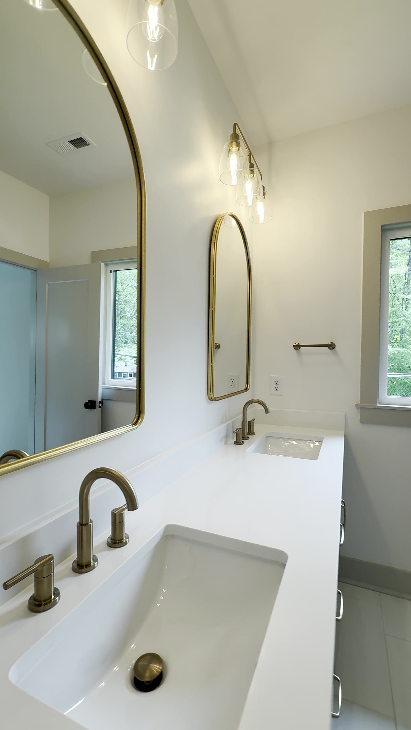Plaza Midwood — primary bathroom with gold fixtures